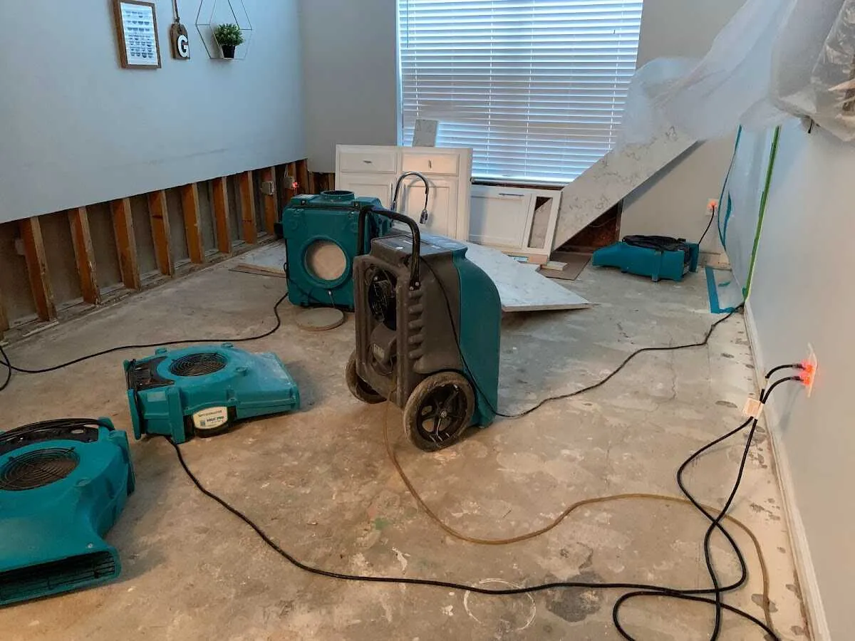 Dehumidifier in flood-cut room for Water Damage Restoration in East Point